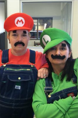 Paul Moak employees in Mario and Luigi costumes